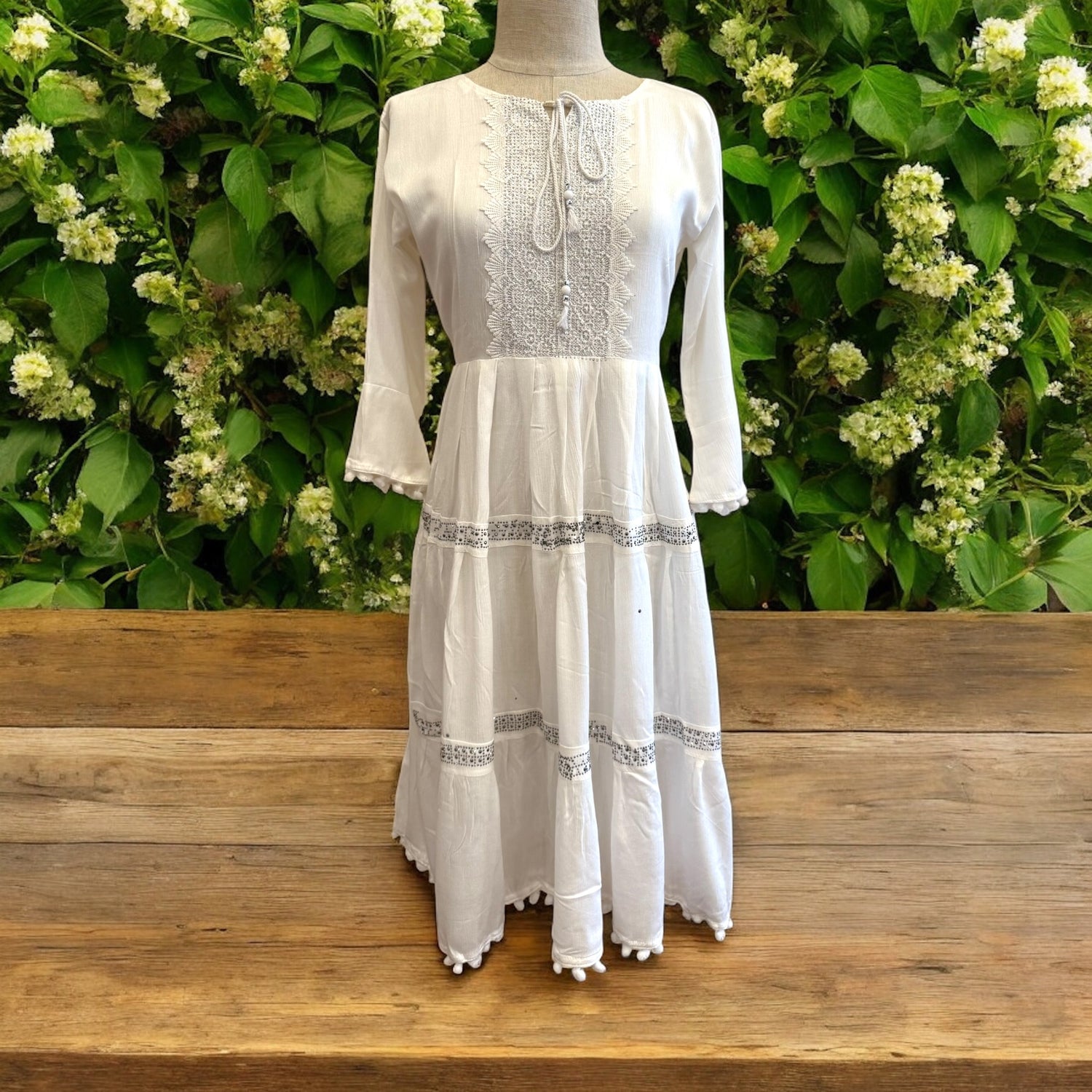 Women's dress with lace and pom pom trim