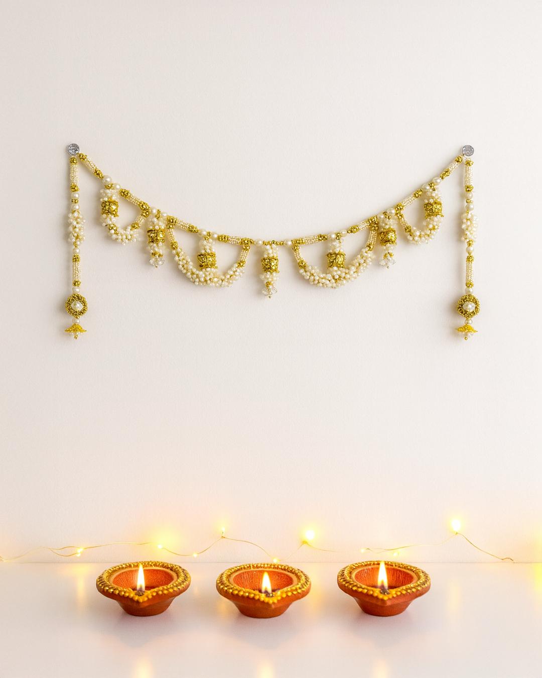 “Royal Pearl & Gold Toran – Traditional Bandhanwar for Festive Homes”